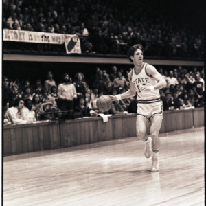 Basketball player at NC State versus East Carolina game, circa 1972-1975