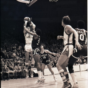Basketball players at NC State versus Furman game, circa 1972-1975