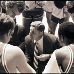 Basketball coach and players at NC State versus Georgia game, circa 1969-1975
