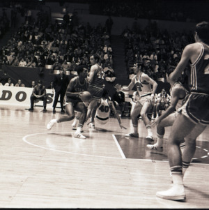 Basketball players at NC State versus Georgia game, circa 1969-1975