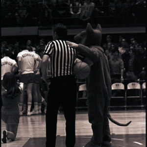 Referee and mascot at NC State versus Georgia basketball game, circa 1971-1972