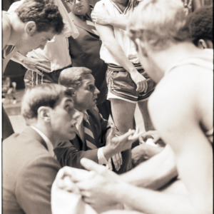Basketball coaches and players at NC State versus Georgia game, circa 1972-1973