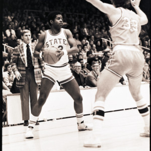 Basketball players and coach at NC State versus Georgia Tech game, circa 1972-1975