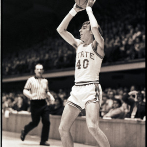 Basketball player and referee at NC State versus Lehigh game, circa 1972-1973