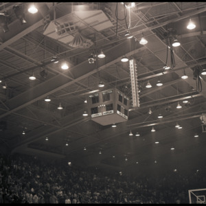 Scoreboard and stands at NC State versus Maryland basketball game, circa 1969