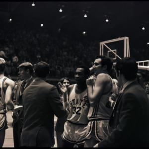 Basketball players and spectators at NC State versus Maryland game, circa 1969