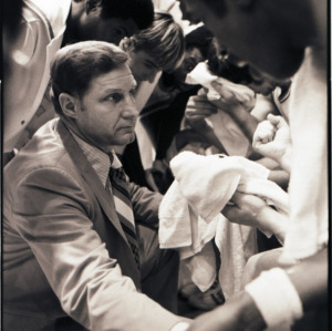 Basketball coach and players at NC State versus Maryland game, circa 1973-1974