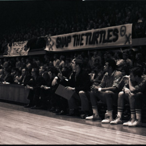 Basketball players and spectators at NC State versus Maryland game, circa 1969-1975