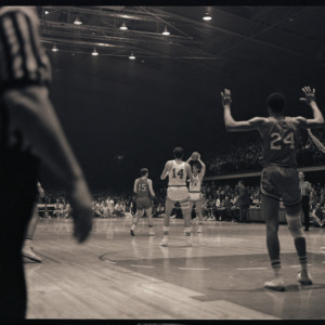 Basketball players and referees at NC State versus Maryland game, circa 1969-1975