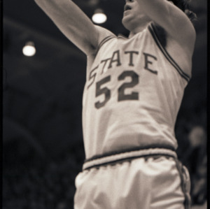 Basketball player at NC State versus Maryland game, circa 1969-1975