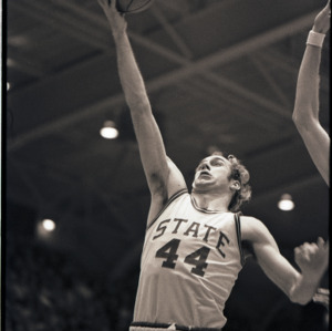 Basketball player at NC State versus Maryland game, circa 1972-1975