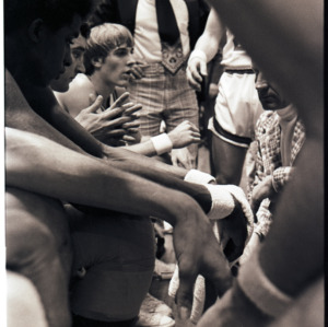 Basketball coach and players at NC State versus Maryland game, circa 1972-1975