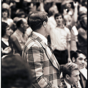 Basketball coach and spectators at NC State versus Maryland game, circa 1972-1975