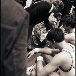 Basketball players and coaches at NC State versus Maryland game, circa 1972-1975