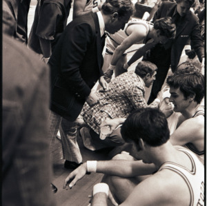 Basketball players and coaches at NC State versus Maryland game, circa 1972-1975