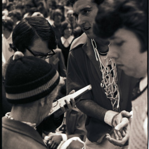 Basketball player and spectators at NC State versus Maryland ACC title game, 1973