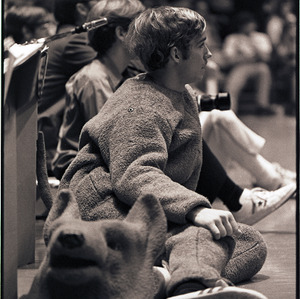 Mascot without head on and spectators at NC State versus Pittsburgh basketball game, January 22, 1972
