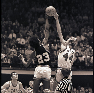 Basketball players and referee at NC State versus Pittsburgh game, January 22, 1972