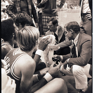 Basketball players and coaches at NC State versus UCLA game, circa 1973-1974