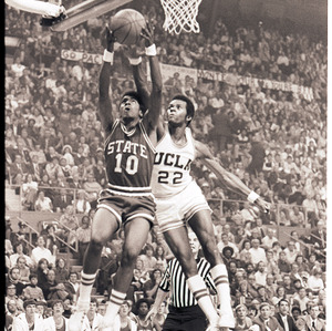 Basketball players and referee at NC State versus UCLA game, circa 1973-1974