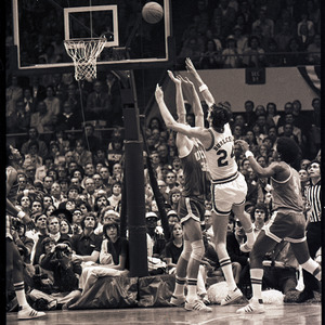 Basketball players and referee at NC State versus UCLA game, circa 1973-1974