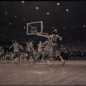 Basketball players and referee at NC State versus UNC-Chapel Hill game, circa 1969