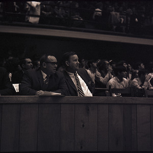 Basketball coaches and spectators at NC State versus UNC-Chapel Hill game, circa 1969