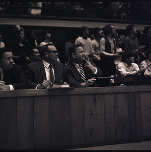 Basketball coaches and spectators at NC State versus UNC-Chapel Hill game, circa 1969