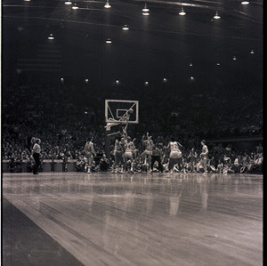 Basketball players and referees at NC State versus UNC-Chapel Hill game, circa 1969