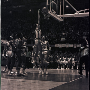 Basketball players and referee at NC State versus UNC-Chapel Hill game, circa 1969