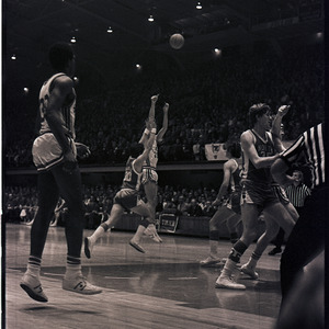 Basketball players and referees at NC State versus UNC-Chapel Hill game, circa 1971