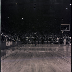 Mascot and spectators at NC State versus UNC-Chapel Hill basketball game, circa 1971