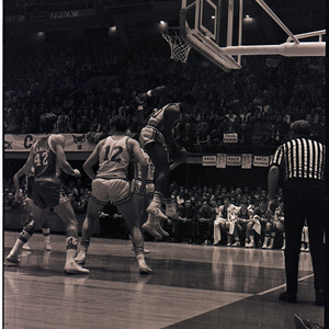 Basketball players and referee at NC State versus UNC-Chapel Hill game, circa 1971