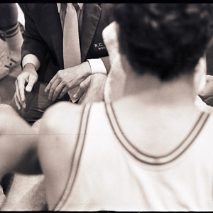 Basketball players and coach at NC State versus UNC-Chapel Hill game, circa 1971