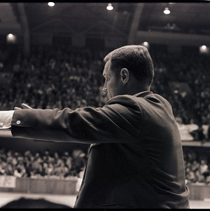 Basketball coach at NC State versus UNC-Chapel Hill game, circa 1971
