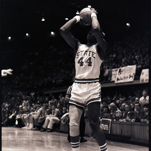 Basketball player at NC State versus UNC-Chapel Hill game, circa 1971-1973
