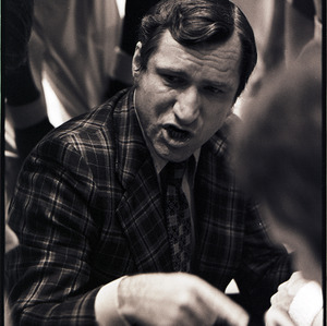 Basketball coach at NC State versus UNC-Chapel Hill game, circa 1973-1974