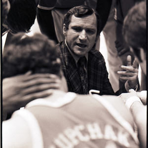 Basketball coach and players at NC State versus UNC-Chapel Hill game, circa 1973-1974