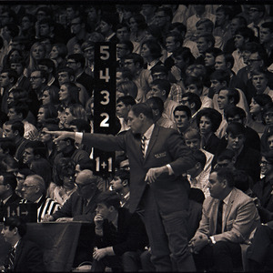 Basketball coaches and spectators at NC State versus UNC-Chapel Hill game, circa 1969-1975