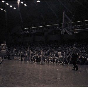 Basketball players and referees at NC State versus UNC-Chapel Hill game, circa 1969-1975