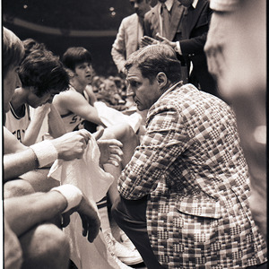 Basketball coach and players at NC State versus UNC-Chapel Hill game, circa 1969-1975