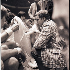 Basketball coach and players at NC State versus UNC-Chapel Hill game, circa 1969-1975