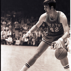 Basketball player at NC State versus UNC-Chapel Hill game, circa 1969-1975