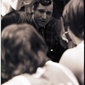 Basketball coach and players at NC State versus UNC-Chapel Hill game, circa 1972-1975