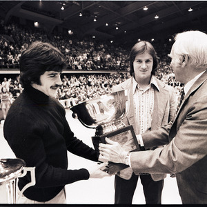 Award presentation at NC State versus UNC-Charlotte basketball game, circa 1972-1974