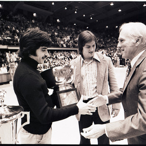 Award presentation at NC State versus UNC-Charlotte basketball game, circa 1972-1974