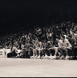 Basketball players and spectators at NC State versus University of South Carolina game, circa 1969