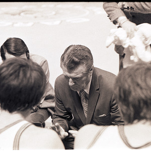 Basketball coaches and players at NC State versus University of South Carolina game, circa 1969
