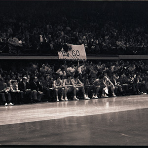 Basketball players and spectators at NC State versus Virginia game, circa 1969-1975