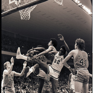 Basketball players at NC State versus Virginia game, circa 1972-1975